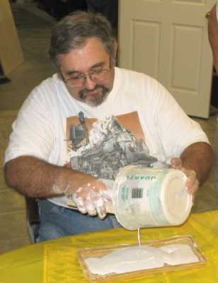 Charlie Richmond pouring Hydrocal in a mold